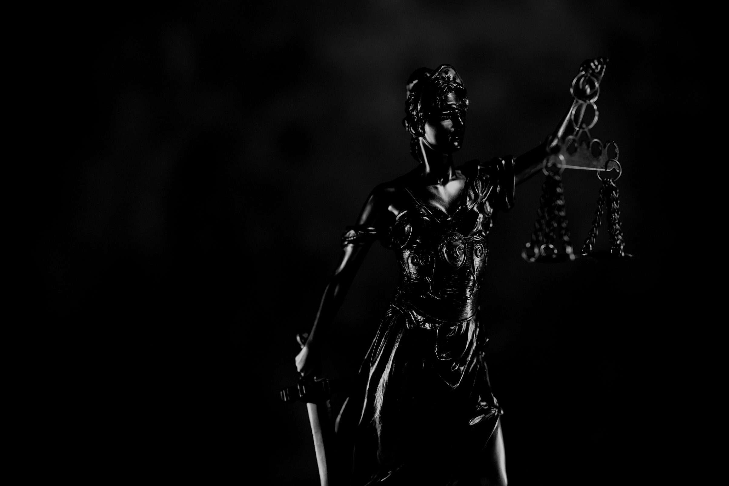Woman in Black Dress Holding Sword